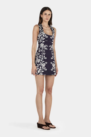 Woman wearing a floral dress on a white background