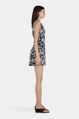 Woman wearing a floral dress on a white background
