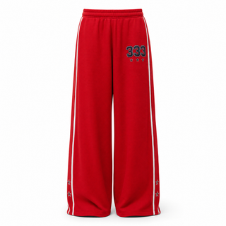 Red wide-leg athletic pants with white side stripes and a black and red '333' graphic on the upper left leg, shown against a plain white background.