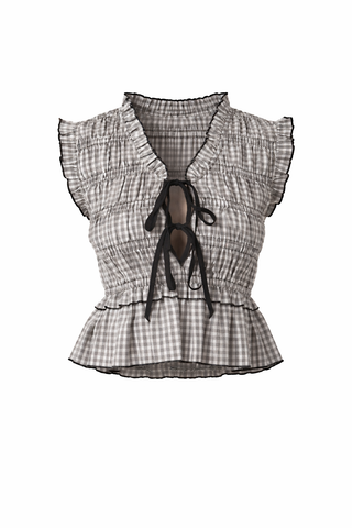 Plaid top with ruffled sleeves and a decorative bow on a white background