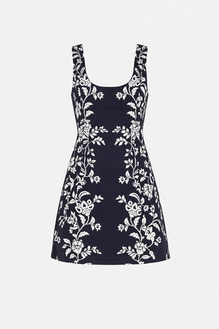 Navy dress with white floral pattern on a white background