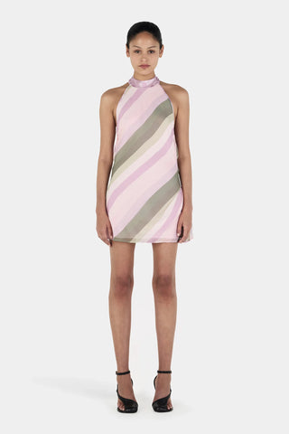 Model wearing a pink and gray striped dress on a white background