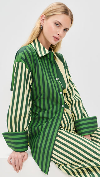 Simon Miller Loch Poplin Button Up Top in green striped combo featuring a collared neckline, long sleeves, button front, and adjustable tie back detail on model