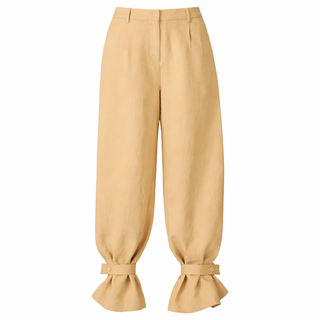 Beige pants with tied cuffs on a white background