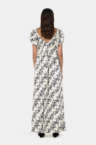 Woman wearing a floral dress on a white background