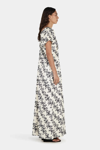 Woman wearing a floral dress on a white background