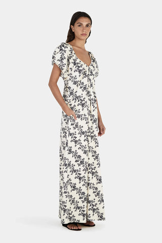 Woman wearing a floral dress on a white background