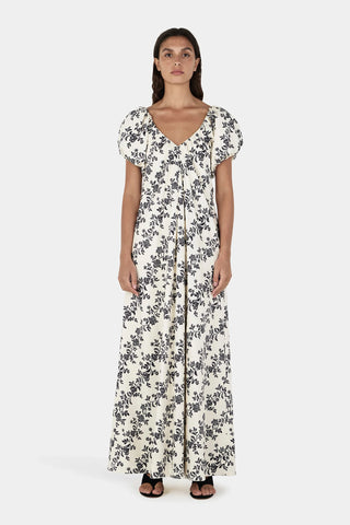 Woman wearing a floral dress on a white background