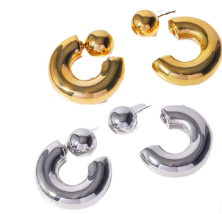 Gold and silver hoop earrings on a white background