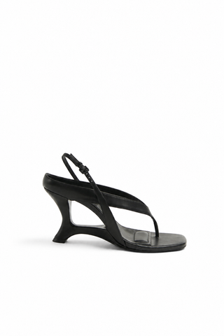 Black sandal with a high heel on a white background