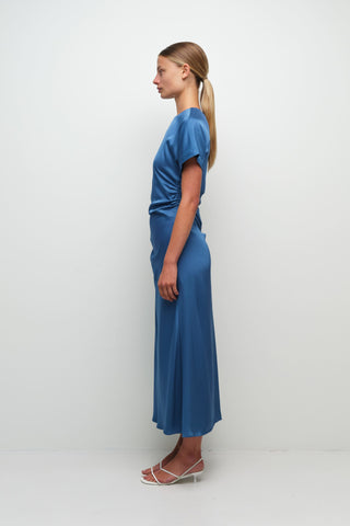 washed indigo satin midi dress, simkhai marabella dress front view, draped midi dress with ruching, short sleeve satin midi dress, side slit blue midi dress, luxury women’s satin dress, elevated occasion midi dress