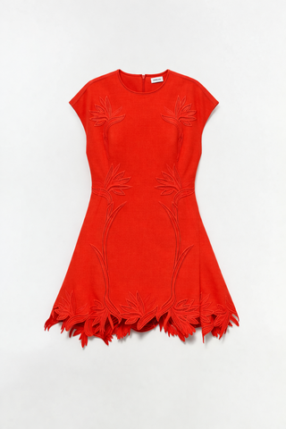 Red dress with cut-out design on a white background