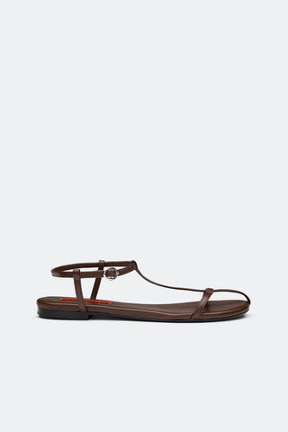 Brown sandal with thin straps on a white background