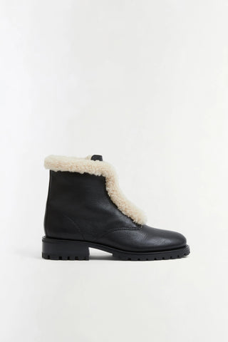 SIMKHAI Noah Shearling Lug Sole Zip Boot in Black Ecru