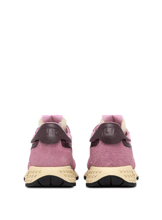Women’s Autry Reelwind sneakers in rose suede and nylon with brown leather side accents, washed finish, and retro runner sole with star tread.