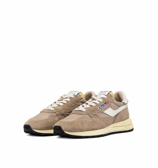 Autry Reelwind Low sneakers in pepper and white with suede and nylon upper, retro runner silhouette and white cushioned sole.