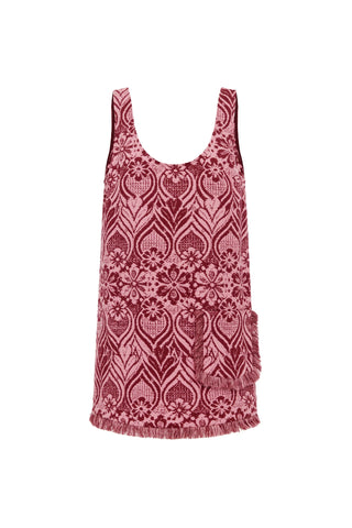 A sleeveless scoop-neck knit top featuring an intricate paisley and floral pattern in dusty rose pink and deep burgundy, finished with a fringed hem and a side pocket.