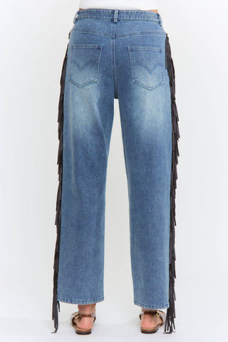 Blue jeans with black fringe on a white background