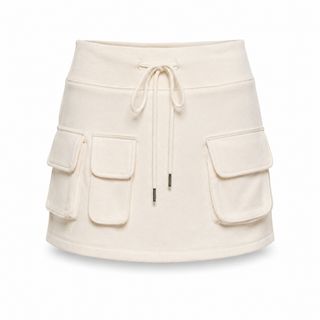 An off-white fleece mini skirt with a drawstring waist and three large cargo pockets, shown against a plain white background.