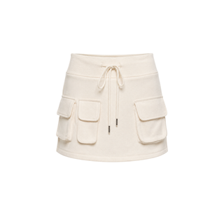 An off-white fleece mini skirt with a drawstring waist and three front cargo pockets, shown against a plain white background.