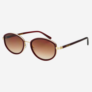 Sunglasses with brown gradient lenses and gold frame on a white background