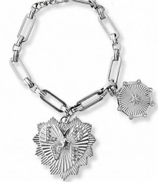 A silver-tone chain bracelet featuring a large heart-shaped charm with a butterfly motif and a smaller sunburst star charm, displayed on a clean white background.