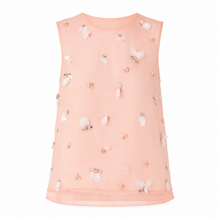 A sleeveless peach-pink mesh top decorated with scattered 3D floral appliqués and small rhinestone embellishments, shown against a plain white background.