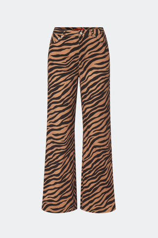 Wide-leg trousers featuring a bold black and tan zebra stripe pattern, displayed against a solid light gray background.