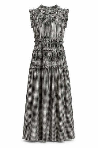 A sleeveless black and white gingham tiered dress with ruffled trim at the collar and waist, shown against a plain white background.