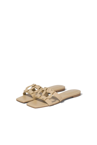 Beige sandals with a strap on a light gray background